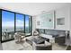 Well-appointed living room with comfortable seating, fireplace, and panoramic ocean views at 100 1St N Ave # 3905, St Petersburg, FL 33701