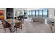 Elegant dining and living room space with a piano, decor and sweeping water views at 100 1St N Ave # 3905, St Petersburg, FL 33701