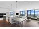 Expansive open-concept living and dining area with floor-to-ceiling windows offering stunning water views at 100 1St N Ave # 3905, St Petersburg, FL 33701