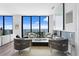 Bright living room with modern decor, fireplace, and stunning ocean views from the balcony at 100 1St N Ave # 3905, St Petersburg, FL 33701