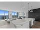 Bright and airy living room with floor-to-ceiling windows offering stunning ocean views and modern furnishings at 100 1St N Ave # 3905, St Petersburg, FL 33701