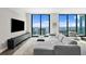 Spacious living area with comfortable seating, entertainment center, and breathtaking ocean views at 100 1St N Ave # 3905, St Petersburg, FL 33701