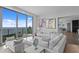 Spacious living room with contemporary furnishings and panoramic water views from large windows at 100 1St N Ave # 3905, St Petersburg, FL 33701