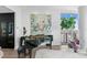 A Steinway piano and decor with a modern art piece and water views at 100 1St N Ave # 3905, St Petersburg, FL 33701