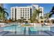 Beautiful pool area with clear blue water, lounge chairs, and lush landscaping, creating a relaxing retreat at 100 1St N Ave # 3905, St Petersburg, FL 33701