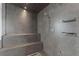 Contemporary tiled shower with built-in seating and recessed shelving at 100 1St N Ave # 3905, St Petersburg, FL 33701