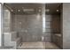 Modern walk-in shower featuring stylish tilework, multiple showerheads, and glass enclosure at 100 1St N Ave # 3905, St Petersburg, FL 33701
