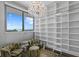 Sitting room with a city view featuring a bookshelf with ladder and two patterned accent chairs at 100 1St N Ave # 3905, St Petersburg, FL 33701