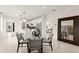 Dining area featuring modern table set and convenient access to kitchen at 10482 Sea Breeze Ridge Dr, Englewood, FL 34223