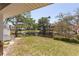 A picturesque backyard view with a tranquil pond, lush greenery, and a serene ambiance at 112 Sun Isle Cir # 112, Treasure Island, FL 33706