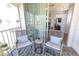 Cozy balcony with seating area leading to interior living space at 112 Sun Isle Cir # 112, Treasure Island, FL 33706