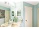 Bathroom featuring a sink and view of the laundry room through an open door at 112 Sun Isle Cir # 112, Treasure Island, FL 33706