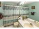Bathroom featuring a sink and a shower with a decorative curtain at 112 Sun Isle Cir # 112, Treasure Island, FL 33706