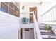 Charming home entryway leading to the front door and stairs at 112 Sun Isle Cir # 112, Treasure Island, FL 33706