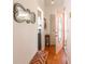 Inviting foyer with hard wood floors and a pink exterior door at 112 Sun Isle Cir # 112, Treasure Island, FL 33706