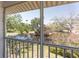 Screened lanai showcasing serene water views surrounded by lush greenery at 112 Sun Isle Cir # 112, Treasure Island, FL 33706