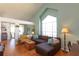 Open concept living room with vaulted ceilings and abundant natural light at 112 Sun Isle Cir # 112, Treasure Island, FL 33706