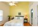 Bright primary bedroom with a ceiling fan and an ensuite bath at 112 Sun Isle Cir # 112, Treasure Island, FL 33706