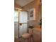 Bathroom with a shower and glass door, neutral countertops and patterned wallpaper at 11323 Highlander Ct, Spring Hill, FL 34609