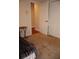 Bedroom with carpeted flooring, a walk-in closet, and access to other rooms at 11323 Highlander Ct, Spring Hill, FL 34609