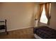 Comfortable bedroom with a window, neutral walls, and carpeted floor, ready for personalization at 11323 Highlander Ct, Spring Hill, FL 34609