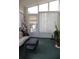 Bright sunroom with lots of windows, a door to the outside, and a comfy sitting area at 11323 Highlander Ct, Spring Hill, FL 34609