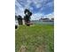 Large backyard with green grass and a fenced perimeter at 11423 77Th Ave, Seminole, FL 33772