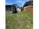Fenced backyard featuring a storage shed at 11423 77Th Ave, Seminole, FL 33772