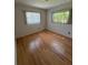 Bright bedroom with hardwood floors and natural light streaming through windows at 11423 77Th Ave, Seminole, FL 33772