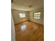 Bright bedroom featuring with hardwood floors, and a window offering natural light at 11423 77Th Ave, Seminole, FL 33772