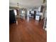 Open concept kitchen with stainless steel appliances, hardwood flooring, and ample counter space at 11423 77Th Ave, Seminole, FL 33772