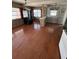 Spacious eat-in kitchen with hardwood flooring, a breakfast bar, and a modern refrigerator at 11423 77Th Ave, Seminole, FL 33772