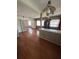 Open kitchen area with hardwood floors, a breakfast bar, and view of the connected dining area at 11423 77Th Ave, Seminole, FL 33772