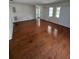 Spacious living room featuring hardwood flooring, bright natural light, and a welcoming atmosphere at 11423 77Th Ave, Seminole, FL 33772
