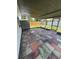 Covered patio with unique tile flooring and a view of the fenced yard at 11423 77Th Ave, Seminole, FL 33772