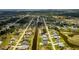 Expansive aerial view of a residential community with waterfront canals and green spaces at 115 White Marsh Ln, Rotonda West, FL 33947