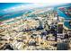 Aerial view of a coastal city with skyscrapers and waterways under a blue sky at 115 White Marsh Ln, Rotonda West, FL 33947
