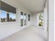 Covered patio with white trim, multiple windows, and glass doors for indoor/outdoor living at 115 White Marsh Ln, Rotonda West, FL 33947