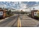 Community entrance with an iron gate, brick columns, and manicured landscaping, providing a secure and welcoming entry at 11617 Crowned Sparrow Ln, Tampa, FL 33626