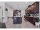 Spacious kitchen with granite countertops, stainless steel appliances, and large center island at 11617 Crowned Sparrow Ln, Tampa, FL 33626