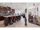 Modern kitchen with granite countertops, stainless steel appliances, and an island with seating at 11617 Crowned Sparrow Ln, Tampa, FL 33626