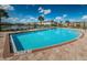 Community pool surrounded by lounge chairs and lush landscaping, providing a perfect spot for relaxation and recreation at 11617 Crowned Sparrow Ln, Tampa, FL 33626