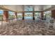 Pool area with a covered structure with tables and chairs, perfect for relaxation and outdoor gatherings at 11617 Crowned Sparrow Ln, Tampa, FL 33626