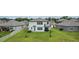 Spacious backyard featuring a well-manicured lawn and a covered patio, perfect for outdoor living at 12189 Nouveau Ave, Spring Hill, FL 34610