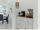 Breakfast nook featuring a coffee bar, built-in cabinets and light tile floors at 12189 Nouveau Ave, Spring Hill, FL 34610