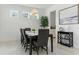 Elegant dining room featuring stylish lighting, a modern dining set, and a serene atmosphere at 12189 Nouveau Ave, Spring Hill, FL 34610