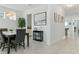 Bright dining room featuring modern lighting, elegant decor, and a spacious layout for comfortable entertaining at 12189 Nouveau Ave, Spring Hill, FL 34610
