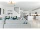Open-concept living area leading to a kitchen with stainless steel appliances and a dining area at 12189 Nouveau Ave, Spring Hill, FL 34610