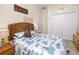 Bedroom featuring a woven headboard and nautical themed comforter at 12337 Rose Haven Blvd, New Port Richey, FL 34654