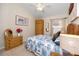 Bedroom with ceiling fan, natural lighting from an exterior window, and coastal decor at 12337 Rose Haven Blvd, New Port Richey, FL 34654